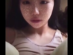 qcVWvgKt Tiny Asian Beauty Finds Bliss in Sensual Facial Fantasies